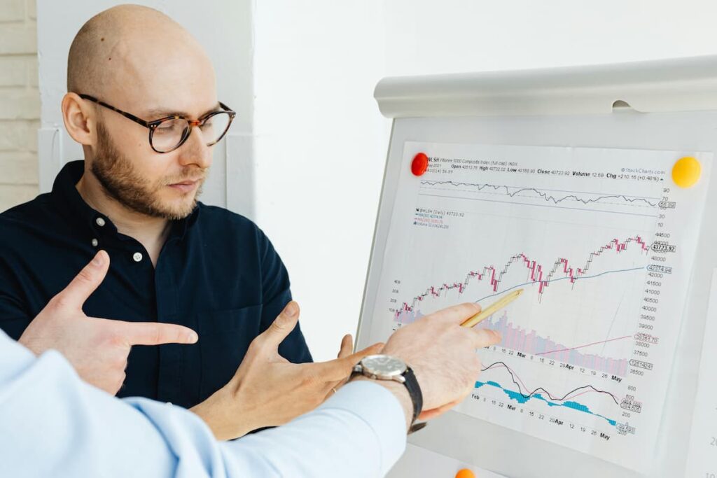 Cryptocurrency market analysts reviewing Bitcoin price trends and market data